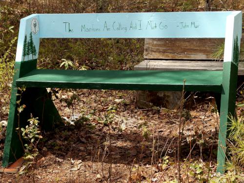 viewing bench with Muir quote in May at Contoocook Marsh near Rindge in southern New Hampshire