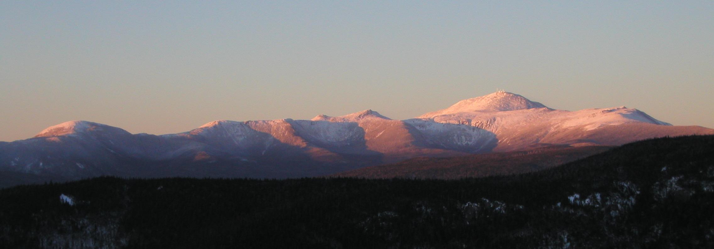 panoramic view of Mount Washington and the southern Presidential Range at sunset from Mount Crawford in New Hampshire