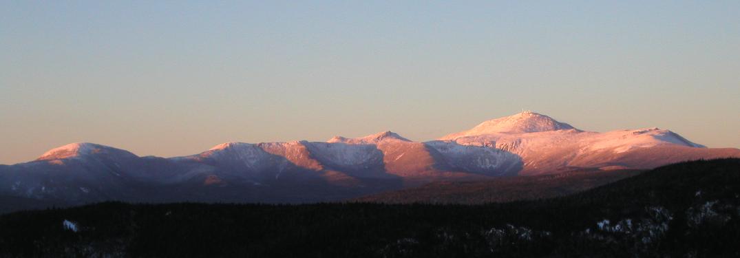 panoramic view of Mount Washington and the southern Presidential Range at sunset from Mount Crawford in New Hampshire