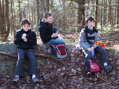 hikers stopping for a snack on the way to Crotched Mountain in New Hampshire