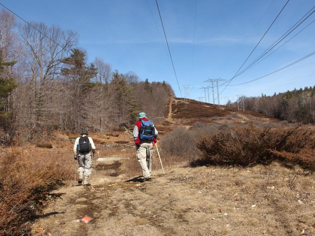 Dick and John walk a powerline swath on a bushwhack to Dickinson Hill and Page hill in New Hampshire