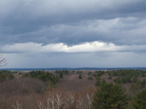 exiting storm clouds in April as seen from atop The Drumlin at Drumlin Farm Wildlife Sanctuary in eastern Massachusetts