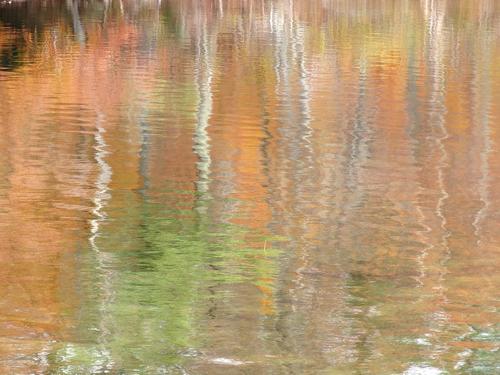 muted fall colors reflected on Dublin Lake in New Hampshire