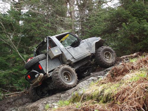 big-wheel Jeep heading toward Snag Pond Peak on the New Hampshire-Quebec boundary swath