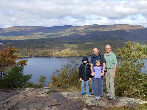 Carl, Talia, David and Fred pose on Eagle Cliff overlooking Squam Lake in New Hampshire
