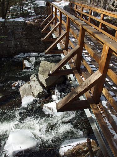 footbridge over Nubanusit Brook on Eastview Rail Trail near Harrisville in southern New Hampshire