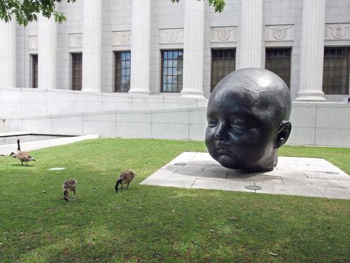 baby head art outside the Museum of Fine Arts in Boston, Massachusetts