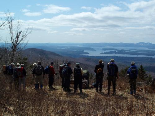 hikers in May at the lookout on Faraway Mountain in New Hampshire