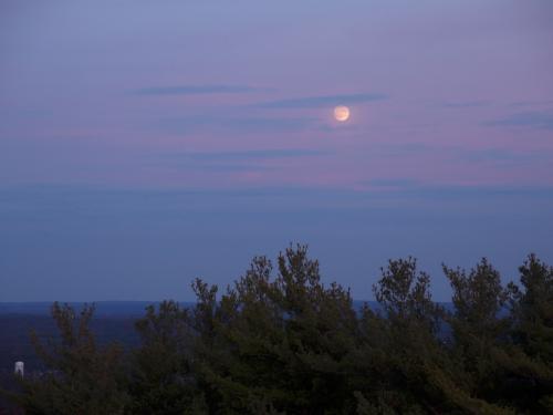 moonrise in November as seen from the firetower atop Federal Hill in southern New Hampshire