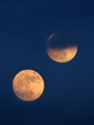 double-exposure moonrise from Federal Hill in New Hampshire