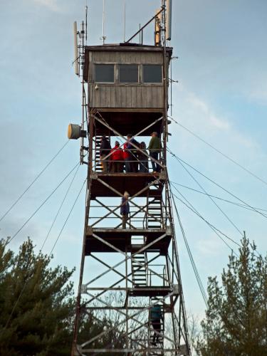 hikers on the firetower atop Federal Hill in southern New Hampshire