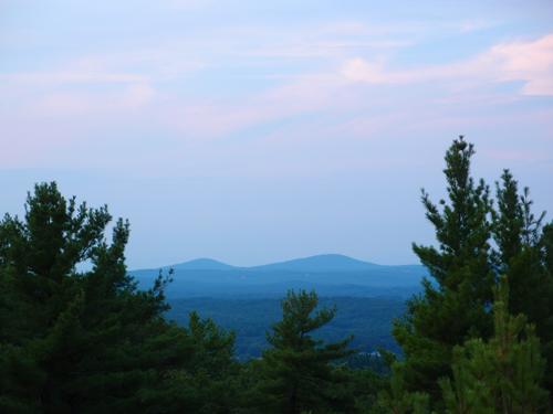 view of the Uncanoonuc Mountains from the fire lookout tower atop Federal Hill in southern New Hampshire