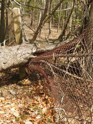 broken fence beside Flat Rock Wildlife Sanctuary at Fitchburg in Massachusetts