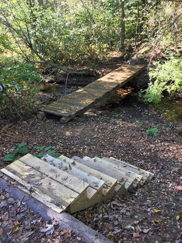 stream crossing bridge and steps at Floodplain Forest near Concord in southern New Hampshire