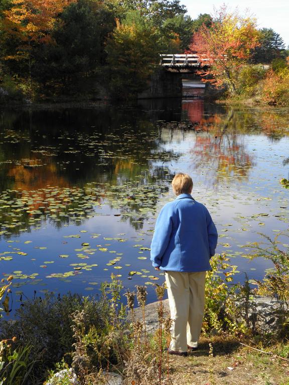 Betty Lou takes in the colorful October view at Clark Pond in southern New Hampshire