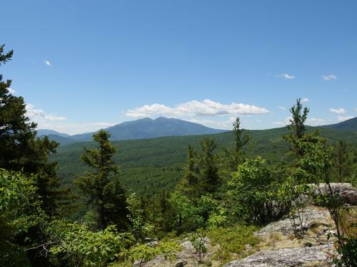 view of the White Mountains from a near-summit ledge of Forest Mountain in northern New Hampshire