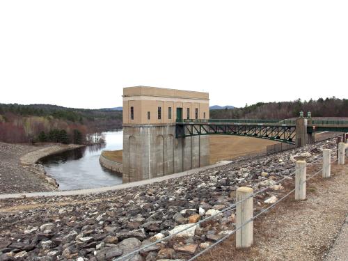 intake tower, access bridge and background reservoir area of Franklin Falls Dam in New Hampshire