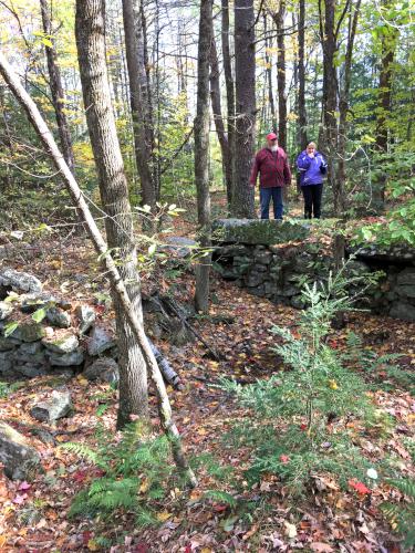 Peter and Andee by stone foundations near Frog Rock in southern New Hampshire