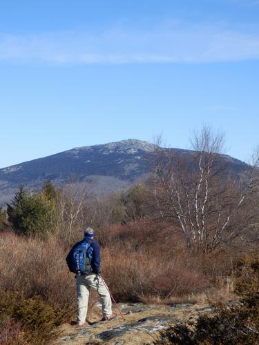 hiker and view of Mount Monadnock from the North Peak of Gap Mountain in New Hampshire