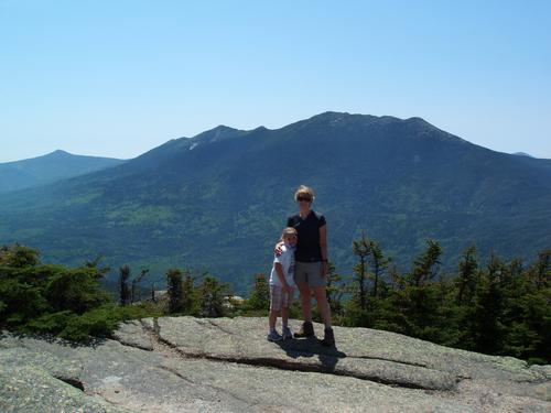 hikers and summit view west from Mount Garfield in New Hampshire