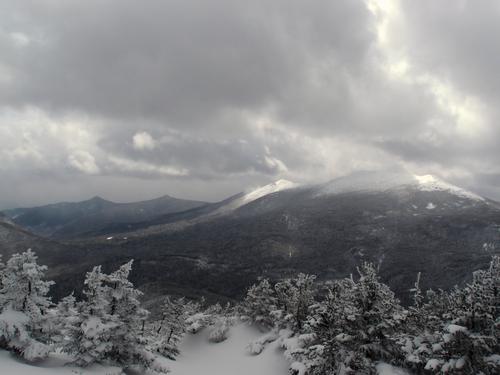 stormy early-spring view of Franconia Ridge (with cloud-covered Mount Lafayette to the right) as seen from Mount Garfield in New Hampshire