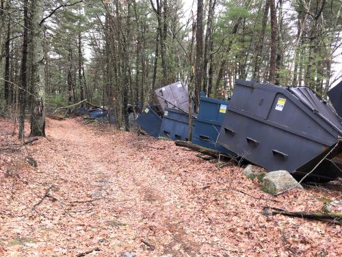 dumpsters beside the trail at Gilson Hill in northeastern Massachusetts