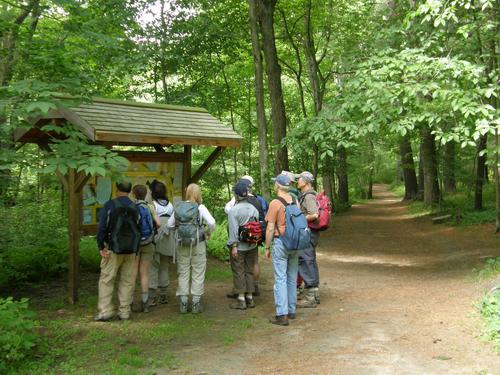 hikers at the kiosk at Goldsmith Reservation in Massachusetts