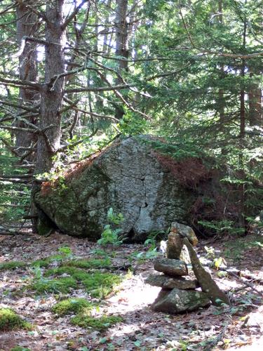 cairn and boulder on the summit of Goodwin Hill in New Hampshire