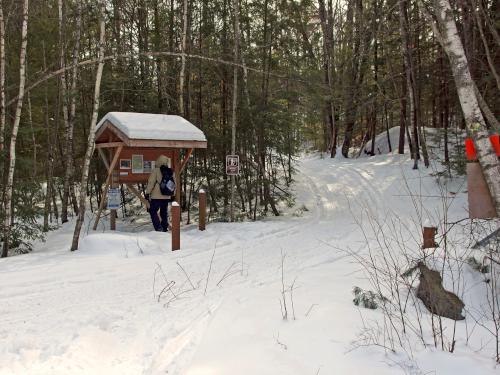kiosk and entrance in February to hiking Great Gains Memorial Forest near Franklin, New Hampshire