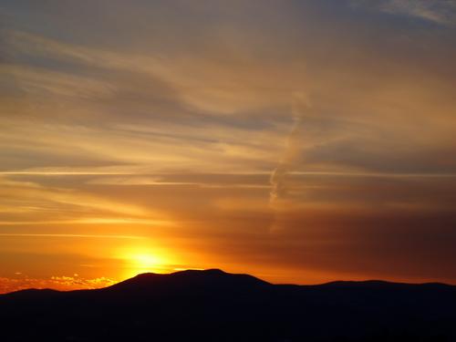 gold sunset over Mount Shaw as seen from Green Mountain in eastern New Hampshire