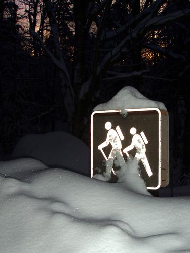Sawyer River Trail sign in pre-dawn winter in New Hampshire
