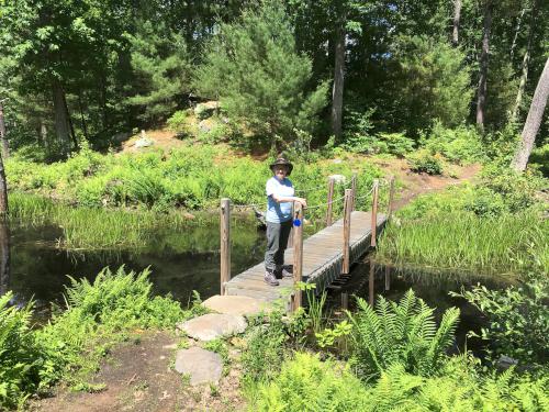 Andee on a footbridge at Gumpus Pond Conservation Area in southern New Hampshire