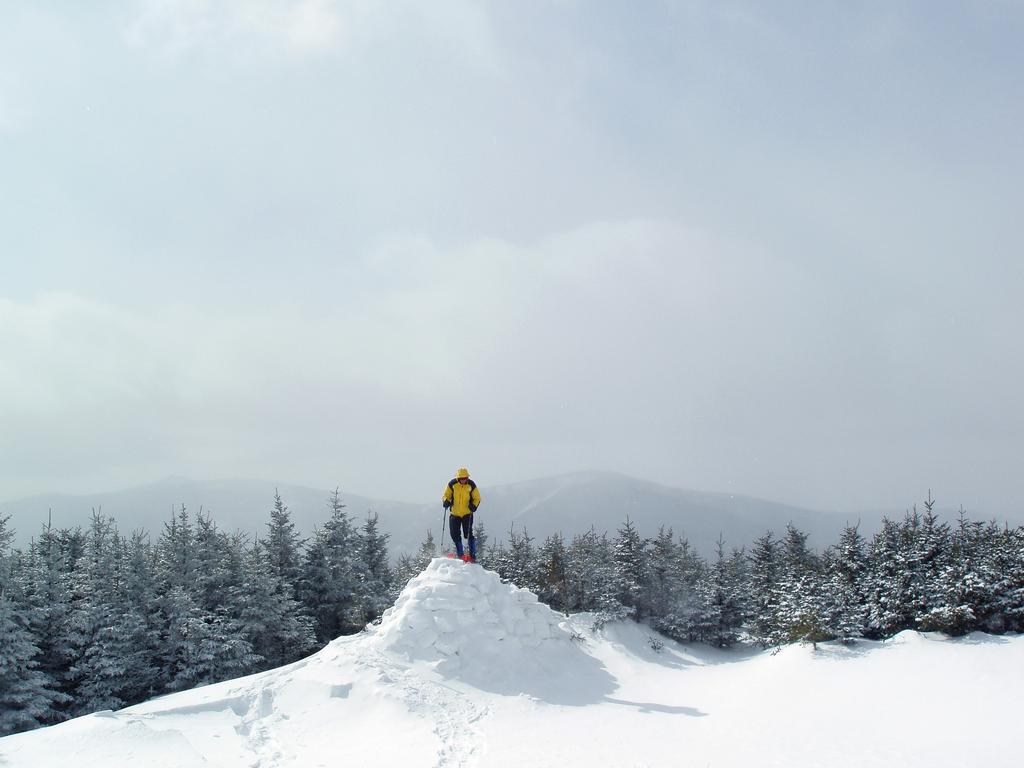 Dave stands atop a snow tower built on the summit of Mount Hale in New Hampshire