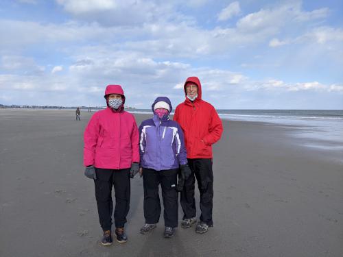 Cathy, Andee and Fred in February on the low-tide sand at Hampton Beach in New Hampshire