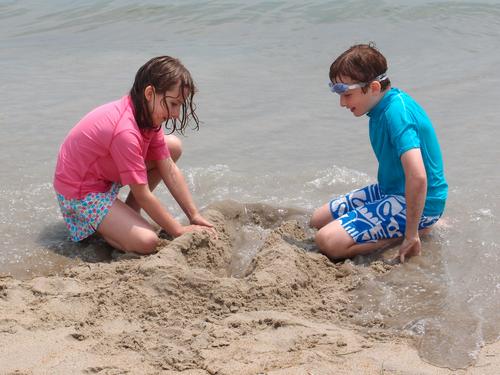 young visitors enjoying the sand at Hampton Beach in New Hampshire