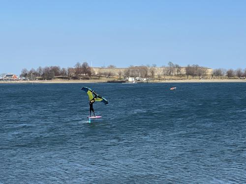 sailboarder in February on Pleasure Bay inside the Boston Harborwalk in Massachusetts
