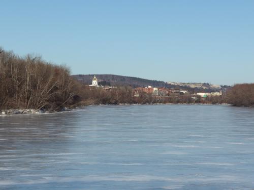 view of the Merrimack River in January from the bridge between Healy and Terrill Parks near Concord in southern New Hampshire