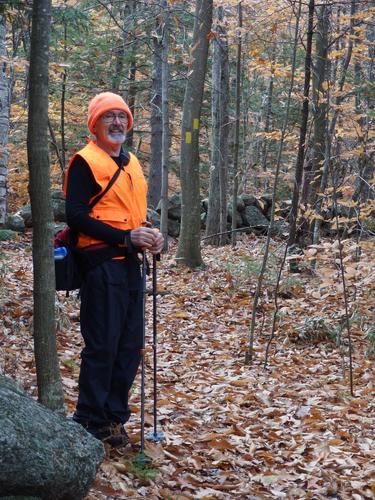 Dick stands on the trail to Hedgehog Mountain at Deering in southern New Hampshire