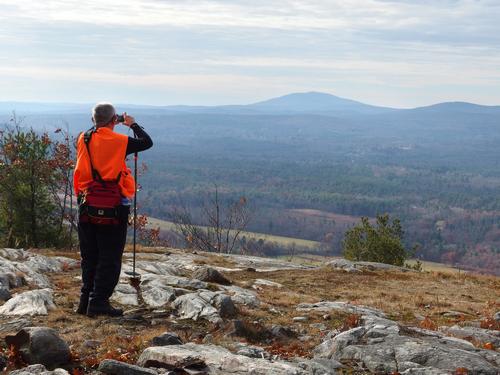 Dick photographs the view of Grand Monadnock Mountain from the summit of Hedgehog Mountain at Deering in southern New Hampshire