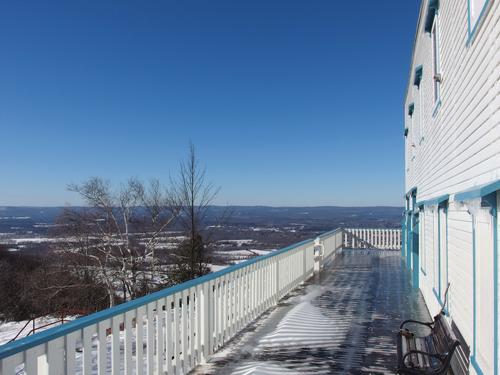 wrap-around porch and broad overview of the Connecticut River valley in winter beauty at the lodge atop Mount Holyoke in central Massachusetts