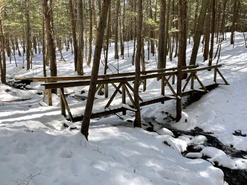 bridge in March at Hopkinton Village Greenway near Hopkinton in southern New Hampshire