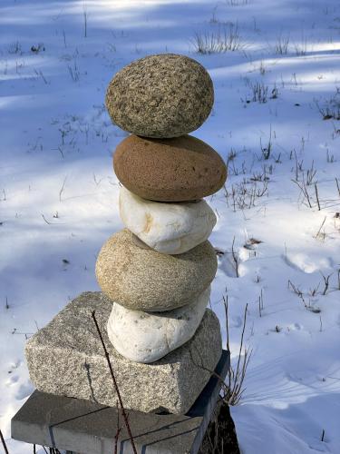 cairn in March at Hopkinton Village Greenway near Hopkinton in southern New Hampshire