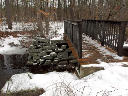 bridge in February over an historic spillway on Hawthorne Brook at Howard Park in northeast Massachusetts