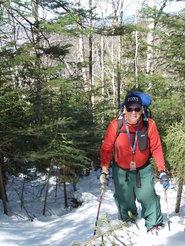 bushwhacking through snow up West Huntington Mountain in New Hampshire