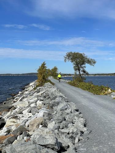 a biker heads out in October on the causeway portion of the Island Line Trail in northwest Vermont