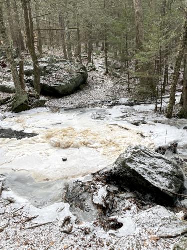 difficult stream crossing in January at Jacobs Hill in north central Massachusetts
