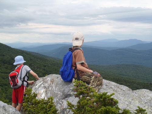 young hikers at The Hogsback viewpoint on Jeffers Mountain in New Hampshire