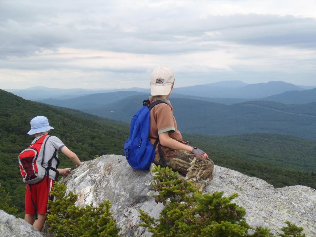young hikers at at the Hogsback lookout on Jeffers Mountain in New Hampshire