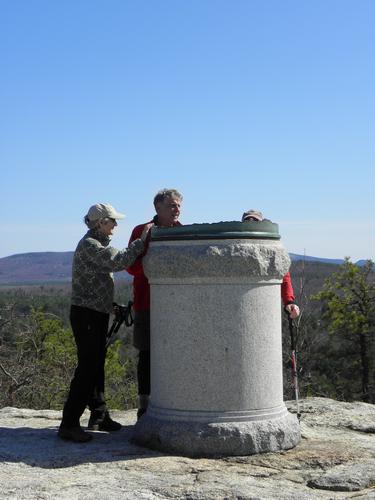 hikers at the summit of Jockey Cap in Maine