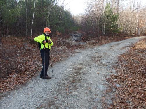 Dick stands at a trail junction in November on the way to Joe English Hill in southern New Hampshire